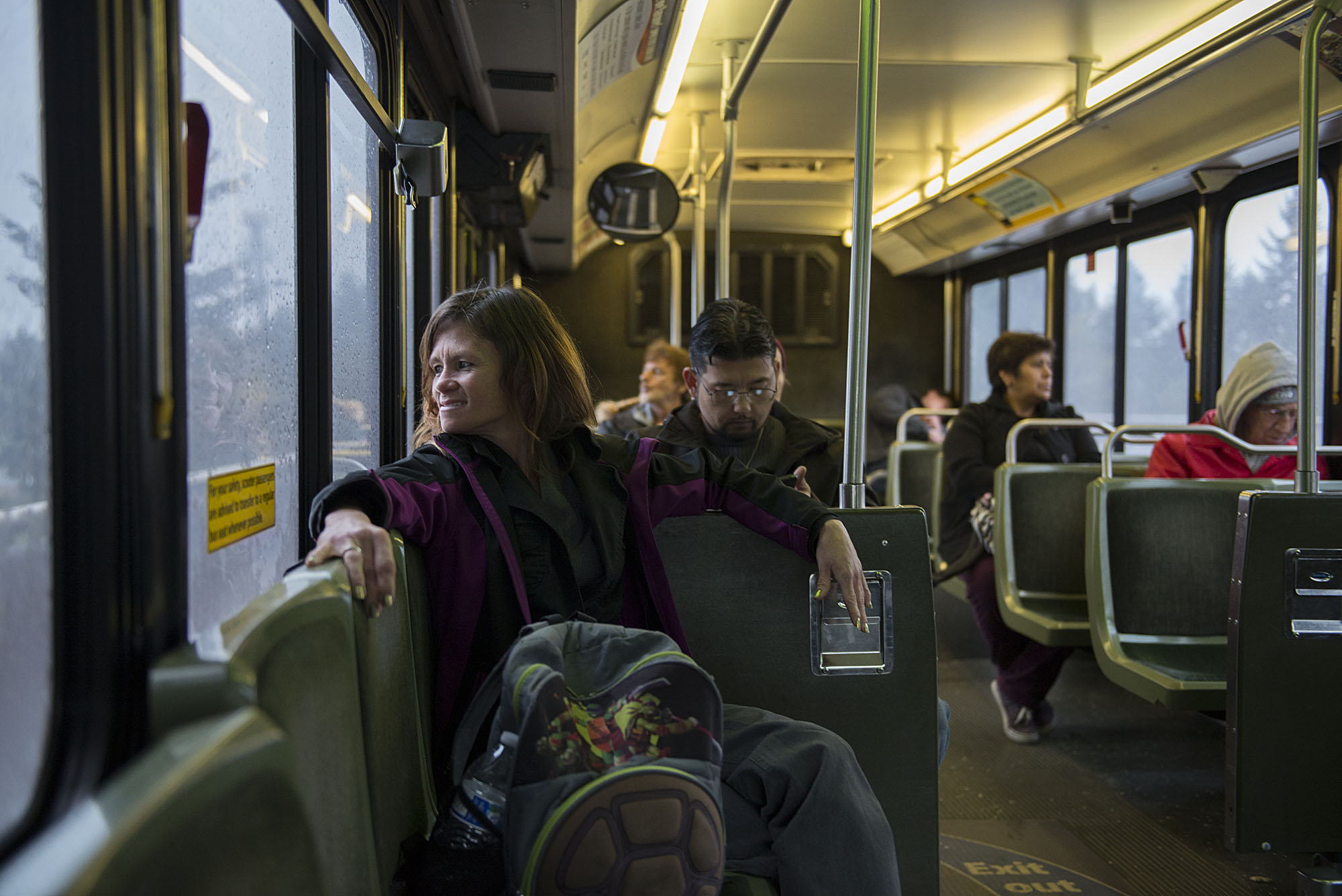 Donna Pinaula catches a ride on a Vancouver bus after applying for a job Tuesday afternoon, Nov. 17, 2015. The bus is a lifeline for Pinaula, who does not have a car and gets around town by riding public transportation, getting rides from people or walking. (Amanda Cowan/The Columbian)