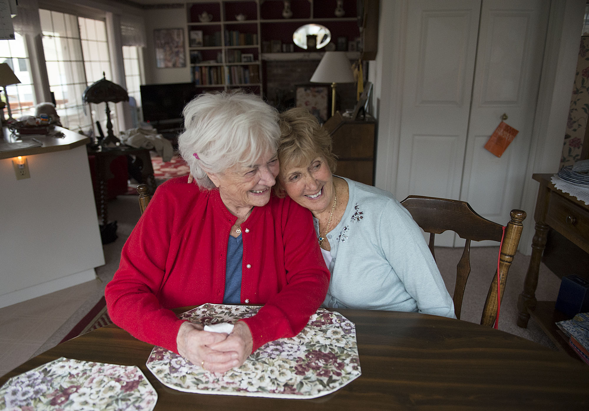 Rita Stewart, left, and her sister, Roma Ekstrom, remember life in England during World War II on Tuesday afternoon, Dec. 15, 2015 at Stewart's Vancouver home. (Amanda Cowan/The Columbian)
